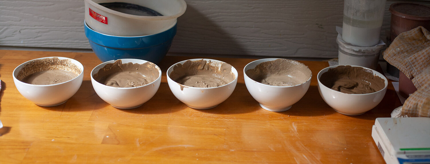 Clay bowls with water added and mixed