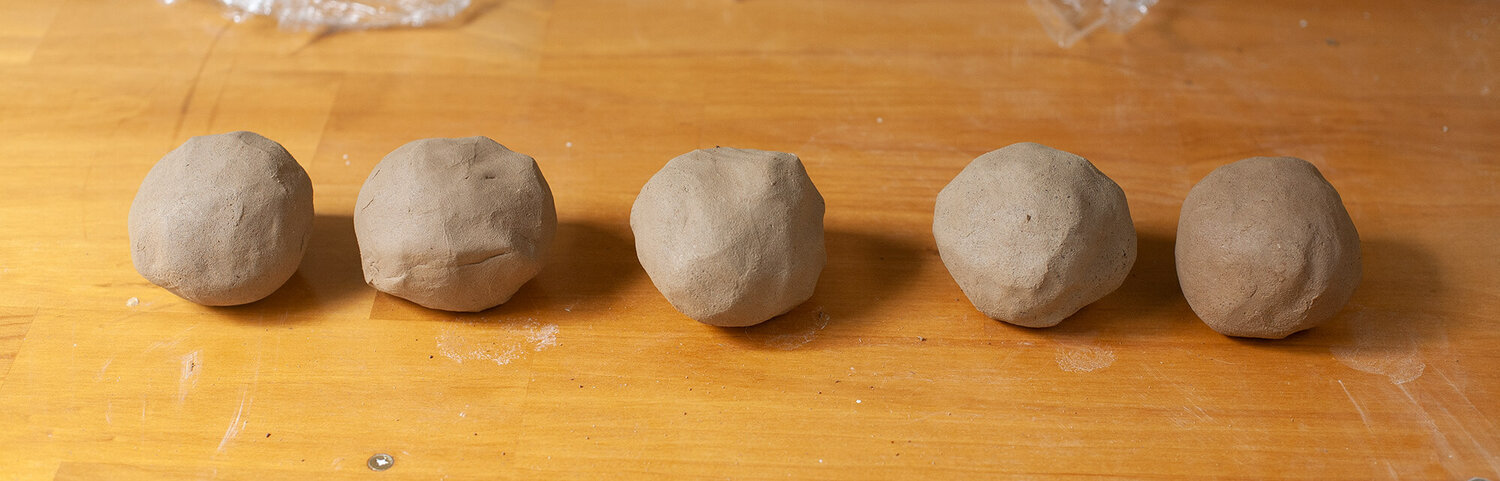 Prepared clay balls ready for throwing